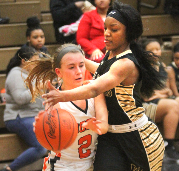 William D Lewis the vindicator  Howland's Izzy Albrecht(2)passes around HArding's Kia Allen (3) during Feb 8, 2017 win over Harding.