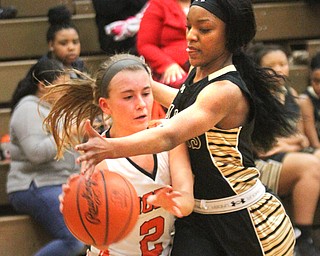 William D Lewis the vindicator  Howland's Izzy Albrecht(2)passes around HArding's Kia Allen (3) during Feb 8, 2017 win over Harding.