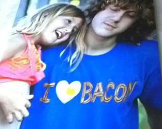 Here’s some sibling love of Rainy and Gavin Linden, grandkids of Linda and Kip Biggs of Leetonia. Rainy loves her big brother, and Gavin loves bacon! Linda sent in this photo.