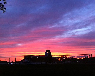 Dawn Zarlingo sent in this description with her photo: “The attached picture is of my fiance, Rodney, and I getting ready to watch fireworks at the Canfield Fairgrounds this past 4th of July. This was made more special for me as I had just moved back to Youngstown – my hometown – after having lived in Pittsburgh for the past 25 years to be with my love. Can you see the heart between us? Oh, what a night!”