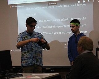 Neighbors | Abby Slanker.Canfield High School students pitching their product, The Cord Clipper, demonstrated their product during their Shark Tank presentation in Sherry Creighton’s Introduction to Business Course on Jan. 6.