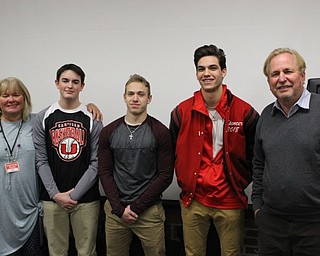 Neighbors | Abby Slanker.The Best Product winners of Canfield High School Shark Tank, pictured with judge Vicki McGee (far left) and judge Jack Scott (far right), were, from left, sophomore Ricky Havrilla, sophomore Richie Herrera and junior Spencer Woolley. The group, also known as Dingerz, Inc., pitched their product, D1 Thumb Guard, during Sherry Creighton’s Introduction to Business Course on Jan. 6.