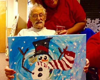 Neighbors | Submitted.Louis Carrozzino showed off his snowman painting with STNA Kristina Floyd after the Paint and Taste event at Beeghly Oaks on Jan. 13.