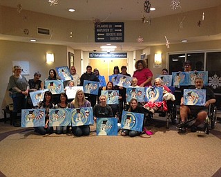 Neighbors | Submitted.Everyone at the Paint and Taste event at Beeghly Oaks on Jan. 13 showed off their finished snowman paintings.