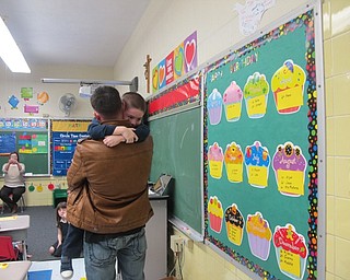 Neighbors | Alexis Bartolomucci.Jason Davis surprised his son Jason Jr. at school after returning home from the Middle East at St. Christine School on Jan. 24.
