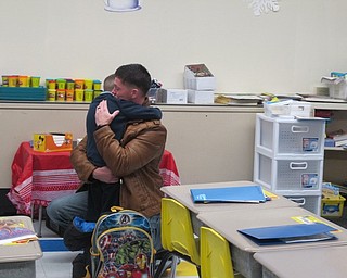 Neighbors | Alexis Bartolomucci. Jason Davis hugged his son after surprising him at St. Christine School on Jan. 24 after returning from the Middle East.