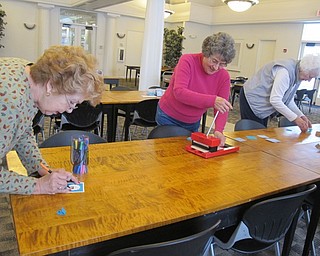Neighbors | Alexis Bartolomucci.Guests at the Austintown library made a hot chocolate holder during the paper craft program on Jan. 27.