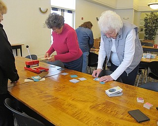 Neighbors | Alexis Bartolomucci.Guests at the paper craft program at the Austintown library on Jan. 27 made hot chocolate holders out of paper and stamps.