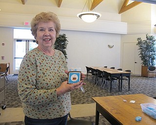 Neighbors | Alexis Bartolomucci.Arlene Getch showed off her hot chocolate holder she made on Jan. 27 during the paper craft program at the Austintown library.