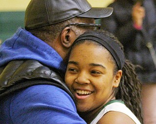 William D Lewis The vindicator Ursuline's Dayshonette Harris(1) gets a hug from her grandfather Gregory Kelch of Youngstown after scoring her 1,00th during opening moments of Feb 9, 2017 game at Ursuline.