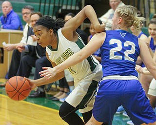 William D Lewis The vindicator Ursuline's Dayshonette Harris(1) drives past Villa Molly Mraz(22)  during opening moments of Feb 9, 2017 game at Ursuline.