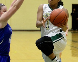 William D Lewis The vindicator Ursuline's Dayshonette Harris(1) drives past Villa MAria's Julia Casella(12) to score during02092017 game at Ursuline.... Feb 9, 2017 game at Ursuline.