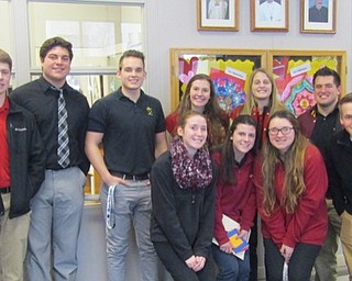 Neighbors | Submitted.St. Charles students work together with alumni from Cardinal Mooney High School on a community service activity during Catholic Schools Week.