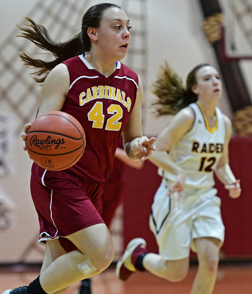 CANFIELD, OHIO - FEBRUARY 9, 2017: Conchetta Rinazdi #42 of Mooney dribbles up court after a tease away ahead of Rachel Maynard #12 of South Range during the first half of their game Thursday night at South Range High School. DAVID DERMER | THE VINDICATOR