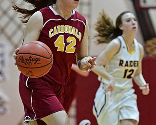 CANFIELD, OHIO - FEBRUARY 9, 2017: Conchetta Rinazdi #42 of Mooney dribbles up court after a tease away ahead of Rachel Maynard #12 of South Range during the first half of their game Thursday night at South Range High School. DAVID DERMER | THE VINDICATOR