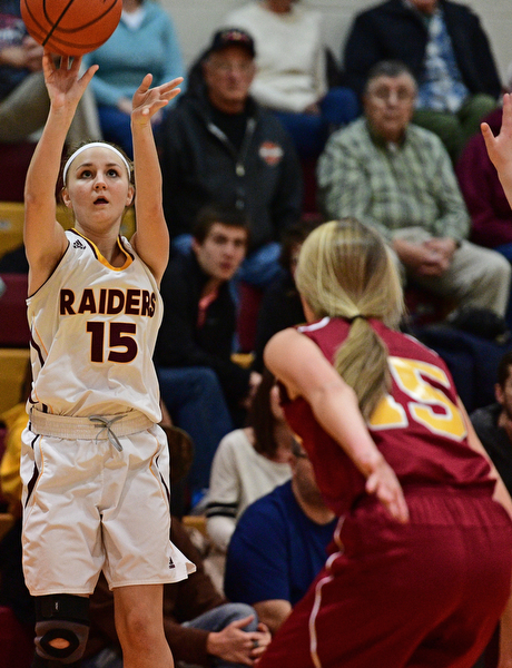 CANFIELD, OHIO - FEBRUARY 9, 2017: Marlaina Salbach #15 of South Range puts up a three point shot over Lauren Frommelt #15 of Mooney during the first half of their game Thursday night at South Range High School. DAVID DERMER | THE VINDICATOR