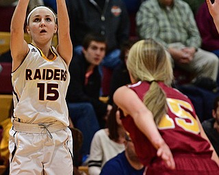 CANFIELD, OHIO - FEBRUARY 9, 2017: Marlaina Salbach #15 of South Range puts up a three point shot over Lauren Frommelt #15 of Mooney during the first half of their game Thursday night at South Range High School. DAVID DERMER | THE VINDICATOR