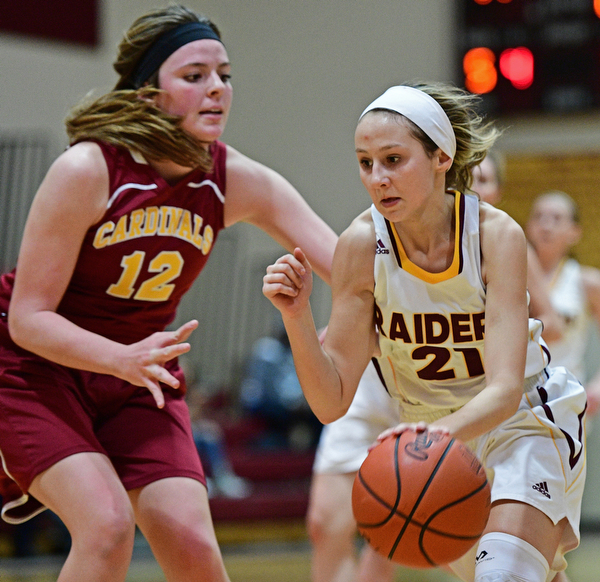 CANFIELD, OHIO - FEBRUARY 9, 2017: Samantha Patrone #21 of South Range drives on Taylor Martin #12 of Mooney during the first half of their game Thursday night at South Range High School. DAVID DERMER | THE VINDICATOR