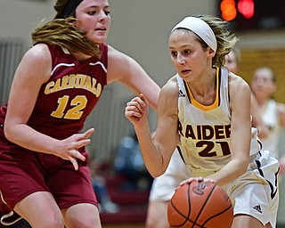CANFIELD, OHIO - FEBRUARY 9, 2017: Samantha Patrone #21 of South Range drives on Taylor Martin #12 of Mooney during the first half of their game Thursday night at South Range High School. DAVID DERMER | THE VINDICATOR