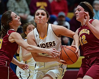 CANFIELD, OHIO - FEBRUARY 9, 2017: Taylor Naples #23 of South Range protects the ball from Cameryn Olesh #3 and Taylor Martin #12 of Mooney during the first half of their game Thursday night at South Range High School. DAVID DERMER | THE VINDICATOR