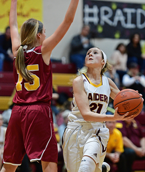 CANFIELD, OHIO - FEBRUARY 9, 2017: Samantha Patrone #21 of South Range goes to the basket while Lauren Frommelt #15 of Mooney during the second half of their game Thursday night at South Range High School. DAVID DERMER | THE VINDICATOR