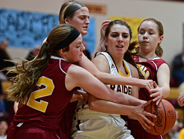 CANFIELD, OHIO - FEBRUARY 9, 2017: Taylor Naples #23 of South Range fights to secure the ball while Taylor Martin #12, Lauren Frommelt #15 and Caitlyn Sapp #32 of Mooney all go for the ball during the second half of their game Thursday night at South Range High School. DAVID DERMER | THE VINDICATOR