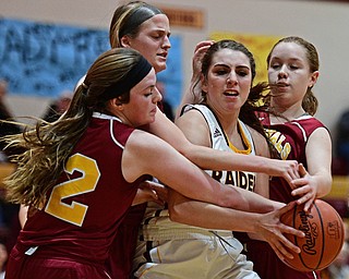 CANFIELD, OHIO - FEBRUARY 9, 2017: Taylor Naples #23 of South Range fights to secure the ball while Taylor Martin #12, Lauren Frommelt #15 and Caitlyn Sapp #32 of Mooney all go for the ball during the second half of their game Thursday night at South Range High School. DAVID DERMER | THE VINDICATOR