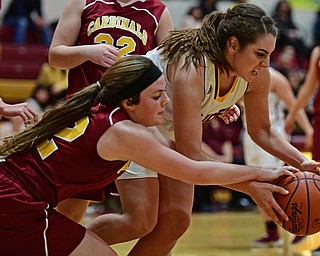 CANFIELD, OHIO - FEBRUARY 9, 2017: Taylor Naples #23 of South Range and Taylor Martin #12 of Mooney battle for the loose ball during the second half of their game Thursday night at South Range High School. DAVID DERMER | THE VINDICATOR