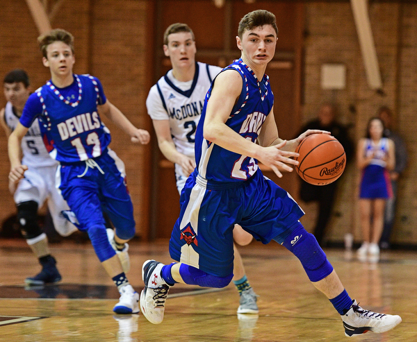 McDONALD, OHIO - FEBRUARY 10, 2017: Cole DeZee #23 of Western Reserve dribbles up court avoiding the press during the first half of their game Friday night at Western Reserve High School. DAVID DERMER | THE VINDICATOR