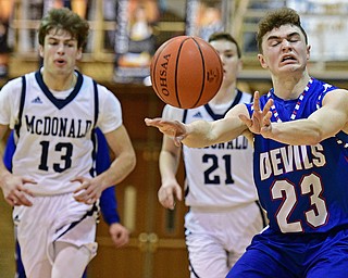 McDONALD, OHIO - FEBRUARY 10, 2017: Cole DeZee #23 of Western Reserve passes the ball up court while being chased by Joey Ragazzine #21 and Dylan Portolese #13 of McDonald during the first half of their game Friday night at Western Reserve High School. DAVID DERMER | THE VINDICATOR