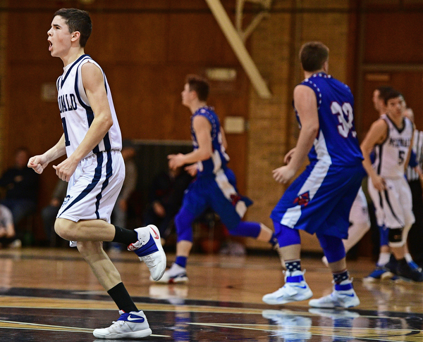 McDONALD, OHIO - FEBRUARY 10, 2017: Zach Rasile #1 of McDonald struts to the bench after draining a deep three beating the buzzer for the end of the second quarter of their game Friday night at Western Reserve High School. DAVID DERMER | THE VINDICATOR