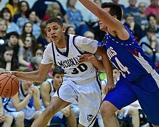 McDONALD, OHIO - FEBRUARY 10, 2017: Braedon Poole #30 of McDonald drives on Jack Cappabianca #34 of Western Reserve during the second half of their game Friday night at Western Reserve High School. DAVID DERMER | THE VINDICATOR