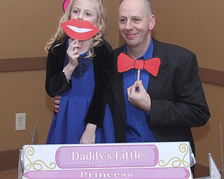 Ken Andersen and his daughter Kiley(7) pose for a photo at the Daddy and Daughter Princess Dance at Lariccia Family Community Center in Boardman Park in Boardman on Saturday, Feb. 11, 2017. ..(Nikos Frazier | The Vindicator)..