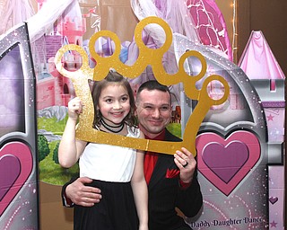 Ronnie Harker and his step-daughter Madison Whyde(8) smile for a photo at the Daddy and Daughter Princess Dance at Lariccia Family Community Center in Boardman Park in Boardman on Saturday, Feb. 11, 2017. ..(Nikos Frazier | The Vindicator)..