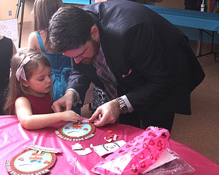 Jack Cochran helps his daughter Megan(5) with some crafts at the Daddy and Daughter Princess Dance at Lariccia Family Community Center in Boardman Park in Boardman on Saturday, Feb. 11, 2017. ..(Nikos Frazier | The Vindicator)..