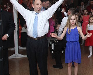 Bob Zupanek and daughter, Sarah(12) spell out YMCA at the Daddy and Daughter Princess Dance at Lariccia Family Community Center in Boardman Park in Boardman on Saturday, Feb. 11, 2017. ..(Nikos Frazier | The Vindicator)..
