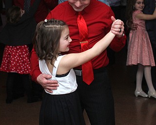Ronnie Harker dances with his step-daughter Madison Whyde(8) at the Daddy and Daughter Princess Dance at Lariccia Family Community Center in Boardman Park in Boardman on Saturday, Feb. 11, 2017. ..(Nikos Frazier | The Vindicator)..