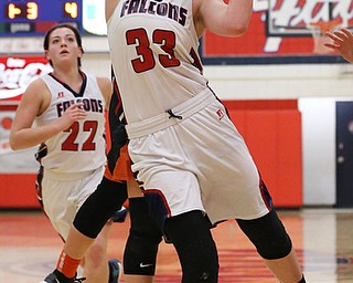 MICHAEL G TAYLOR | THE VINDICATOR- 02-11-17  -Basketball-  2nd qtr., Fitch's #33 Sabria Hunter drives  against Howland's #14 Kendyl Buckley and is fouled. Lady Basketball- Howland Tigers vs Austintown Fitch Falcons at Austintown Fitch High School, Austintown, OH