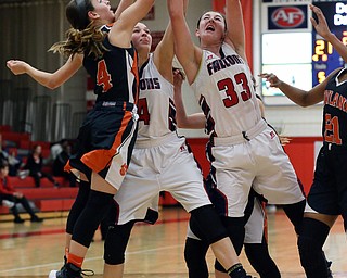MICHAEL G TAYLOR | THE VINDICATOR- 02-11-17  -Basketball-  2nd qtr., Fitch's #33 Sabria Hunter, Fitch's #4  Mikayla Hibbs and Howland's #4 Mackenzie Mzae battle for the rebound. Lady Basketball- Howland Tigers vs Austintown Fitch Falcons at Austintown Fitch High School, Austintown, OH