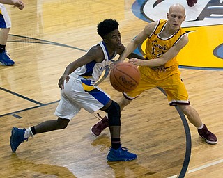 MICHAEL G TAYLOR | THE VINDICATOR- 02-11-17  -Basketball-  1st qtr., Mooney's #12 John Mikos and  YVC #4 Jamynk Jackson battle for the ball. Cardinal Mooney vs Youngstown Valley Christian Eagles at Youngstown Valley Christian High School, Youngstown, OH.