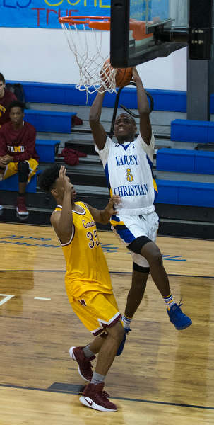 MICHAEL G TAYLOR | THE VINDICATOR- 02-11-17  -Basketball-  2nd qtr., YVC #5 Milan Square shoots over Mooney's #35 Jordan Stanford. Cardinal Mooney vs Youngstown Valley Christian Eagles at Youngstown Valley Christian High School, Youngstown, OH.