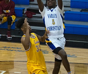 MICHAEL G TAYLOR | THE VINDICATOR- 02-11-17  -Basketball-  2nd qtr., YVC #5 Milan Square shoots over Mooney's #35 Jordan Stanford. Cardinal Mooney vs Youngstown Valley Christian Eagles at Youngstown Valley Christian High School, Youngstown, OH.