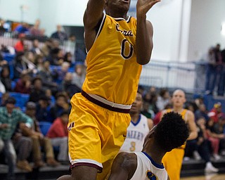 MICHAEL G TAYLOR | THE VINDICATOR- 02-11-17  -Basketball-  4th qtr., Mooney's #0 Terrell Brown shoots over YVC #4 Jamynk Jackson. Cardinal Mooney vs Youngstown Valley Christian Eagles at Youngstown Valley Christian High School, Youngstown, OH.
