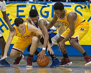 MICHAEL G TAYLOR | THE VINDICATOR- 02-11-17  -Basketball-  3rd qtr., Mooney's #44 Luke Pecchia (left), Mooney's #0 Terrell Brown (right) and YVC #12 Jordan Towers scramble for the ball. Cardinal Mooney vs Youngstown Valley Christian Eagles at Youngstown Valley Christian High School, Youngstown, OH.