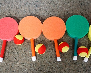        ROBERT K. YOSAY  | THE VINDICATOR..Balls and lollipop raquets... await the young tennis players hands.. Poland Presbyterian  preschool students are using the new tennis equipment the Poland Presbyterian Weekday Preschool got via a US Tennis Association grant..-30-