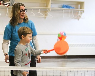        ROBERT K. YOSAY  | THE VINDICATOR..Perfect serve.. as William Snyder hits the ball over the net as "miss mary"   Pugh  watches.. Poland Presbyterian  preschool students are using the new tennis equipment the Poland Presbyterian Weekday Preschool got via a US Tennis Association grant..-30-
