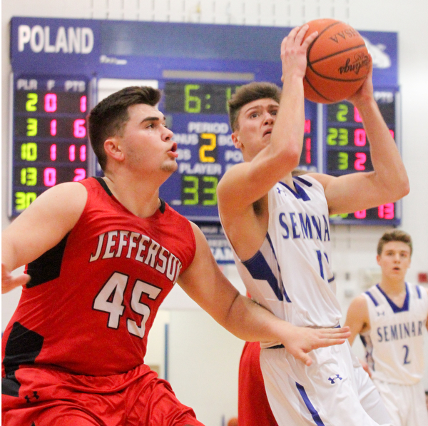 William D. Lewis the vindicator  Poland's Brandon Barringer(13) shoots around Jefferson'sSam Chaney(45) to score during Feb 13, 2017 action at Poland.