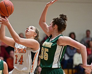 NEWTON FALLS, OHIO - FEBRUARY 13, 2017: Kayla Barreca #14 of Newton Falls goes to the basket while being pressured by Lindsay Bell #35 of Ursuline during the first half of their game Monday night at Newton Falls High School. DAVID DERMER | THE VINDICATOR