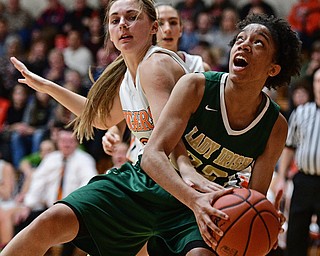 NEWTON FALLS, OHIO - FEBRUARY 13, 2017: Simone Comer #32 of Ursuline looks to the basket while being fouled by Hannah Harnichar #3 of Newton Falls during the first half of their game Monday night at Newton Falls High School. DAVID DERMER | THE VINDICATOR