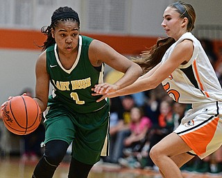 NEWTON FALLS, OHIO - FEBRUARY 13, 2017: Dayshanette Harris #1 of Ursuline drives on Tori Blandine #5 of Newton Falls during the first half of their game Monday night at Newton Falls High School. DAVID DERMER | THE VINDICATOR